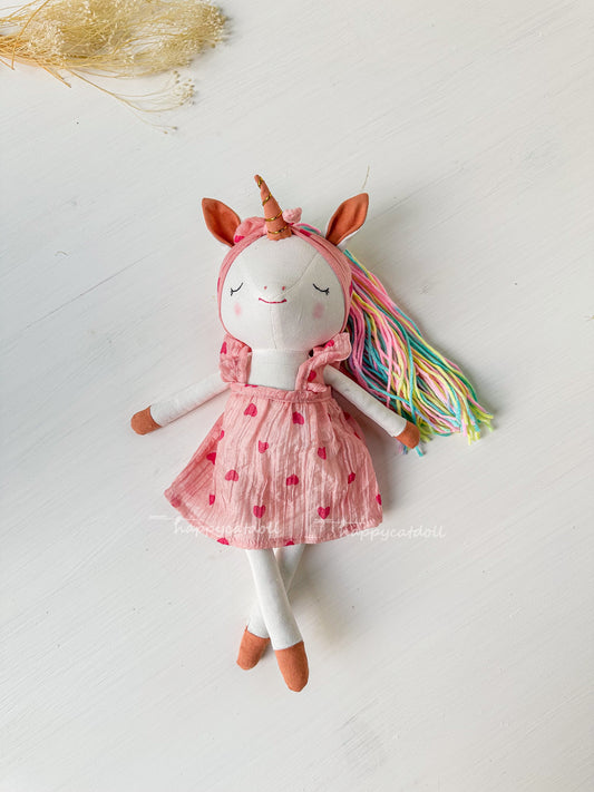 Unicorn doll with pink hearts dress
