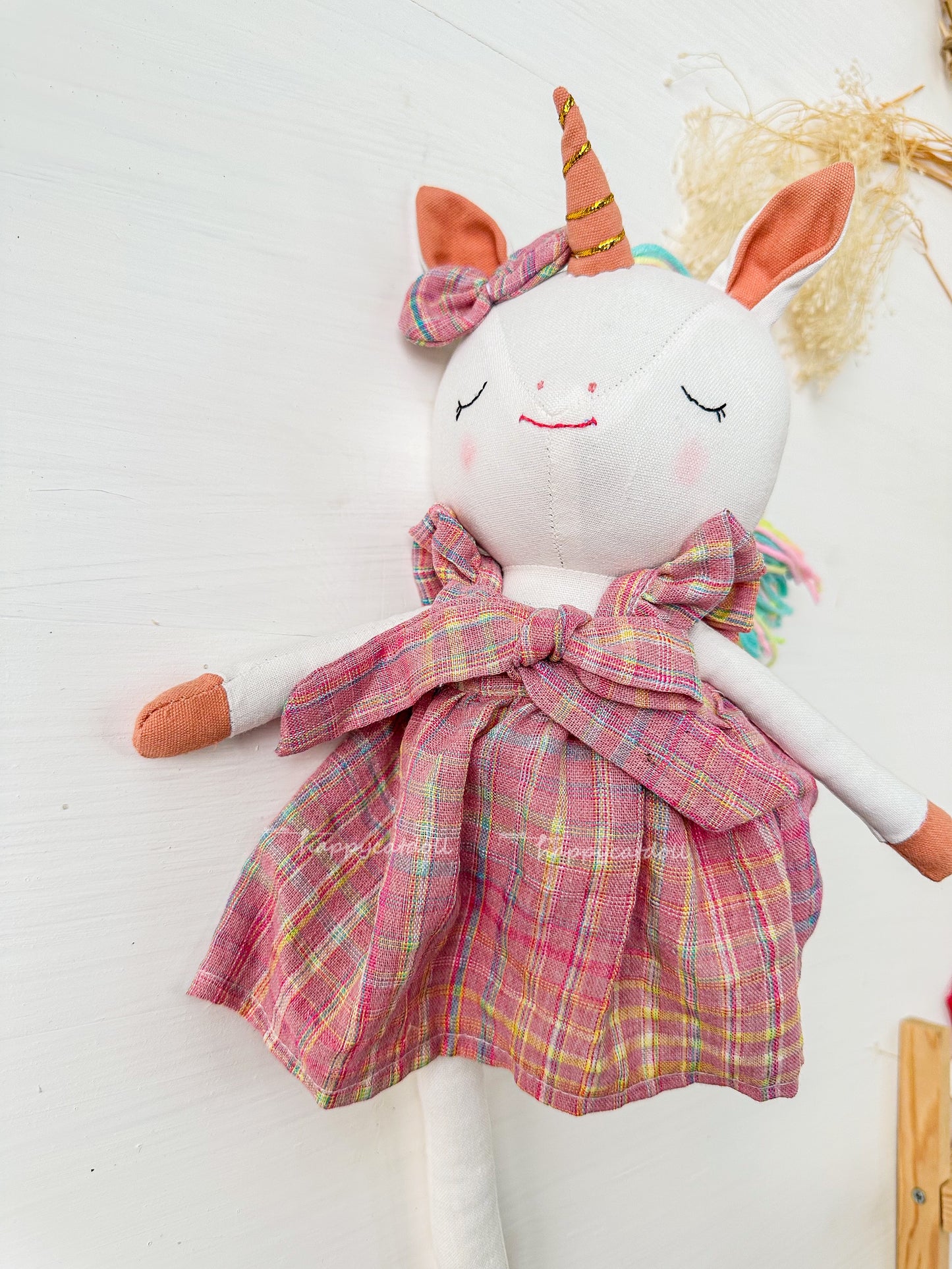 Unicorn with pink checkered dress