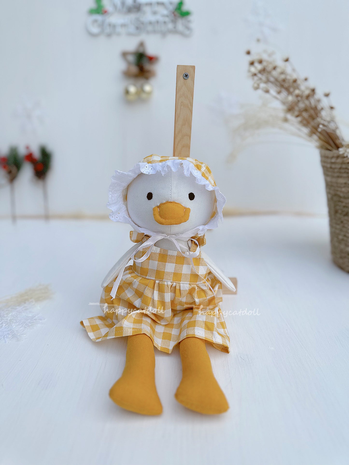 Duck doll with yellow checkered dress