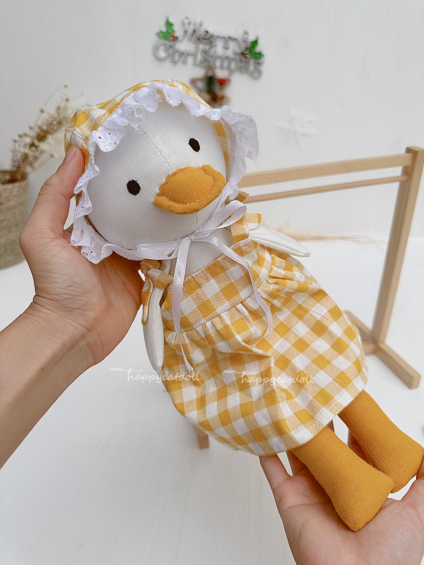 Duck doll with yellow checkered dress