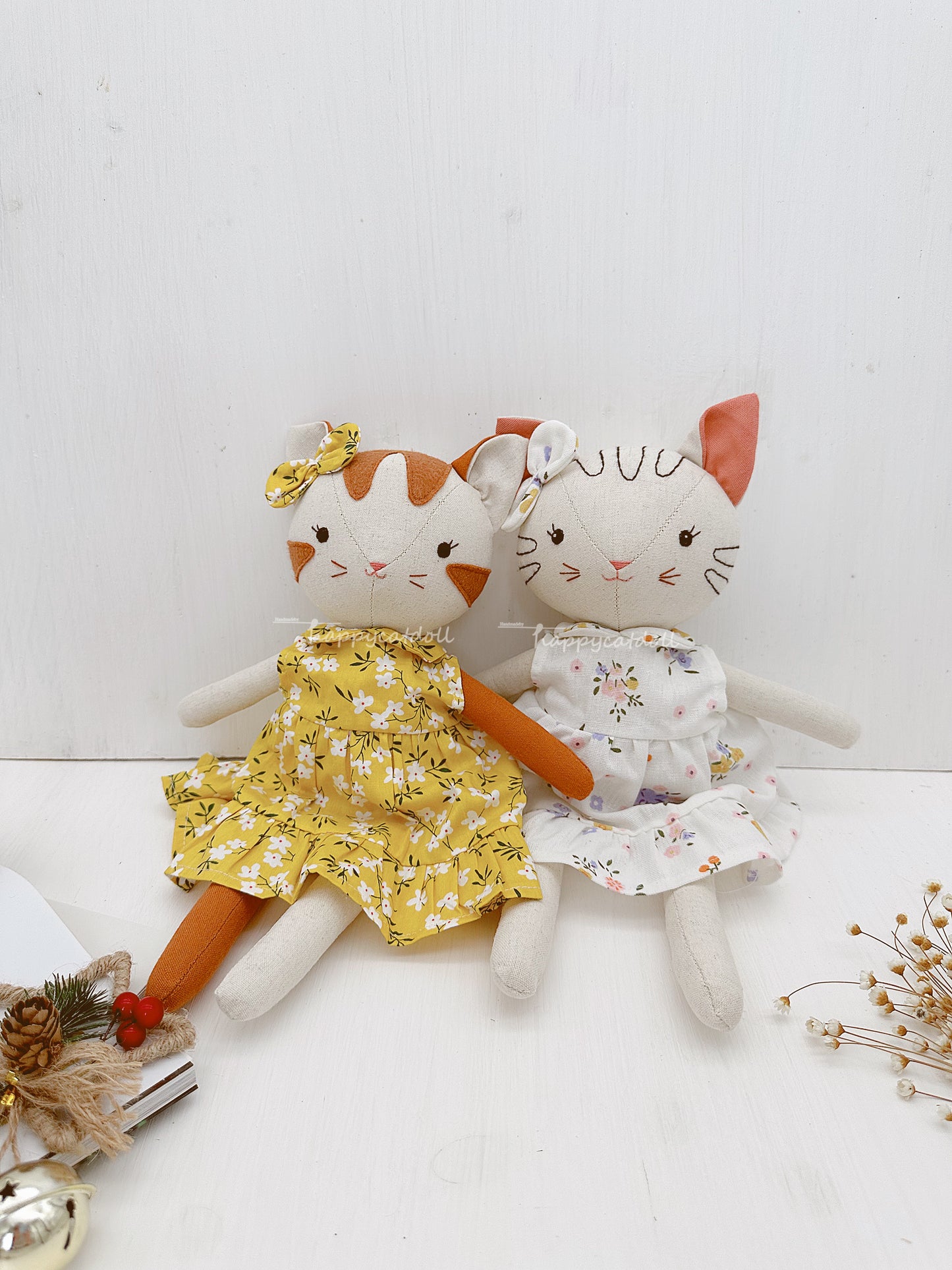 Two cute cat dolls with floral dresses