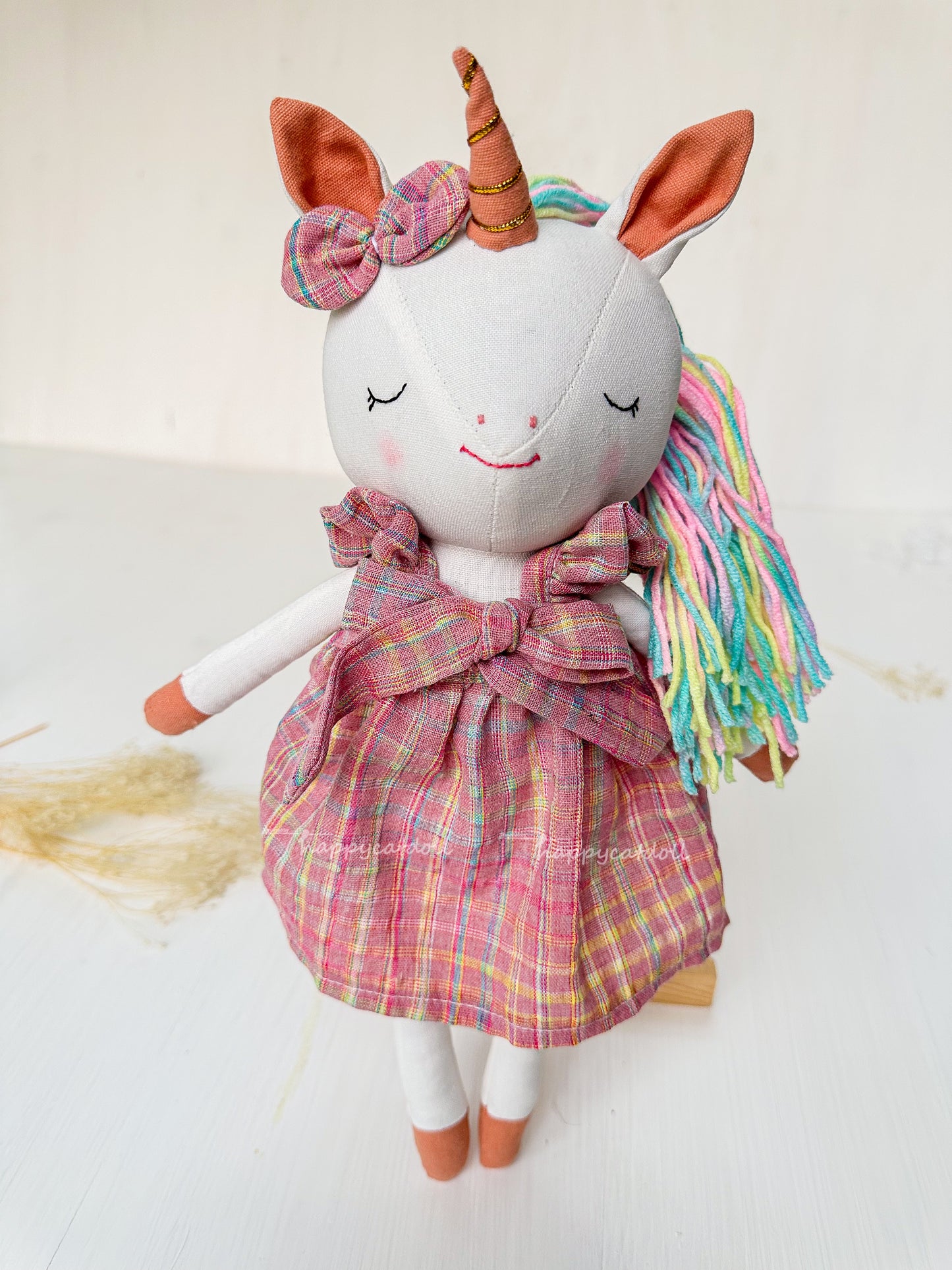 Unicorn with pink checkered dress