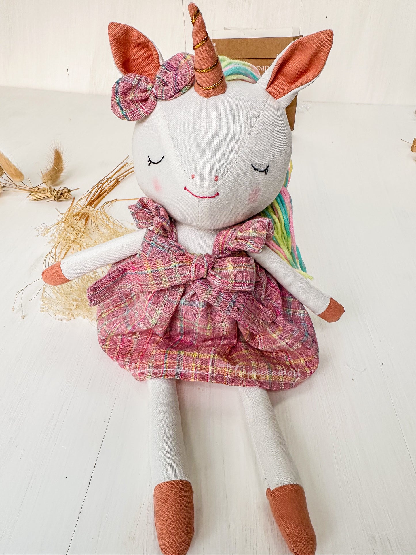 Unicorn with pink checkered dress