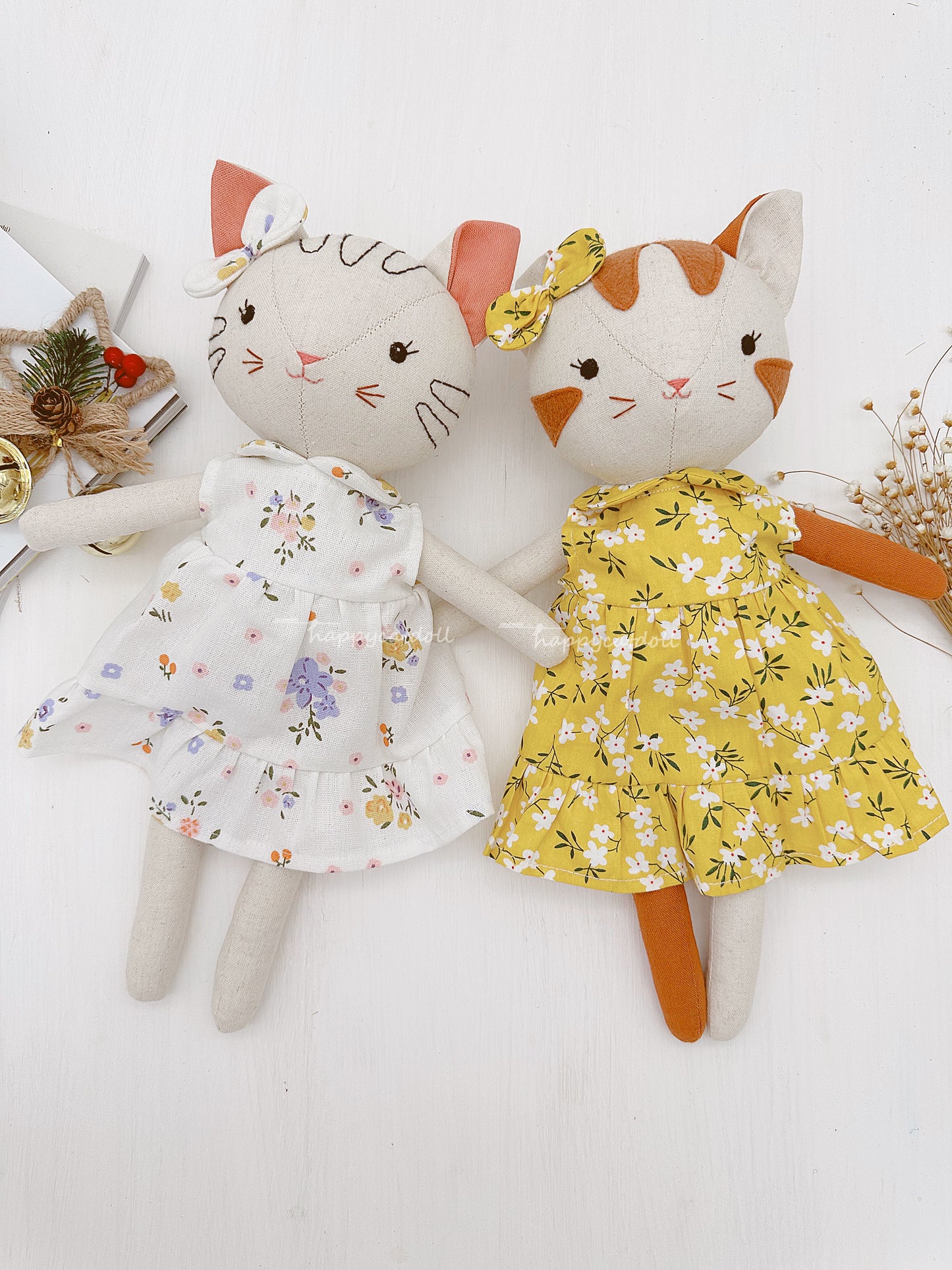 Two cute cat dolls with floral dresses