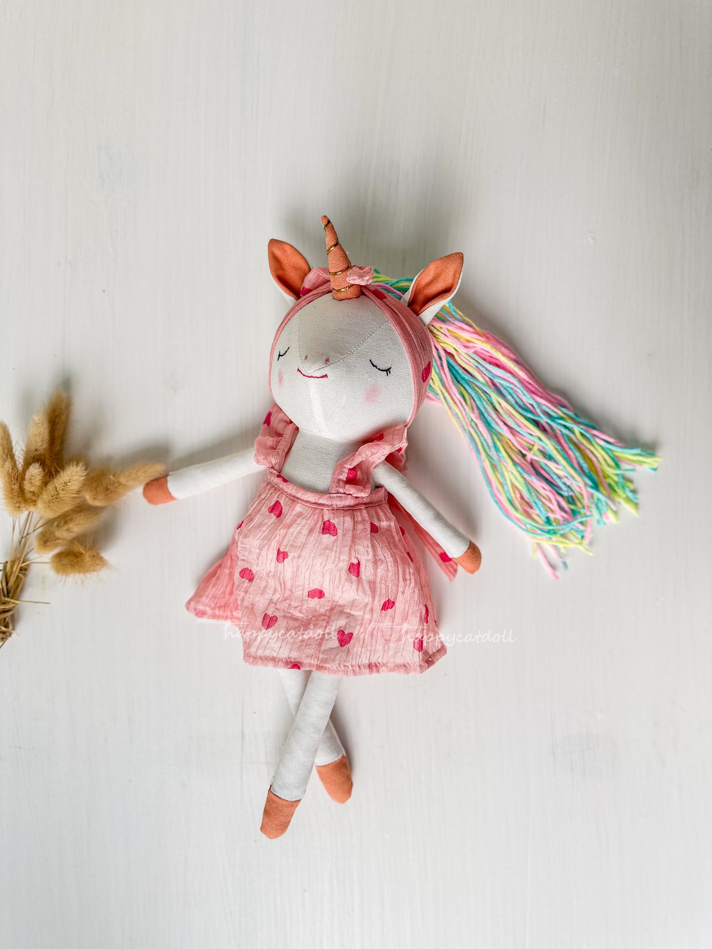 Unicorn doll with pink hearts dress