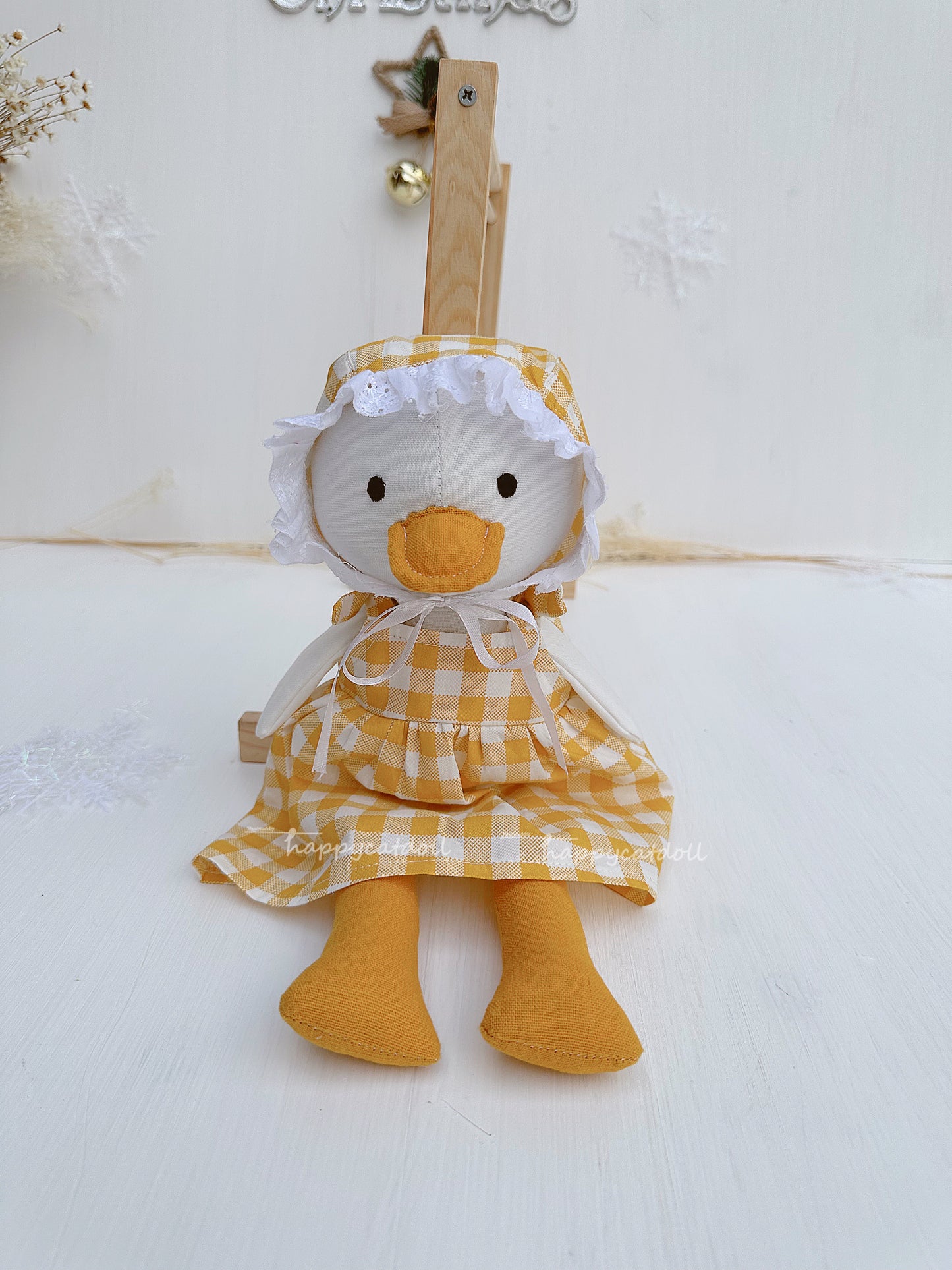 Duck doll with yellow checkered dress