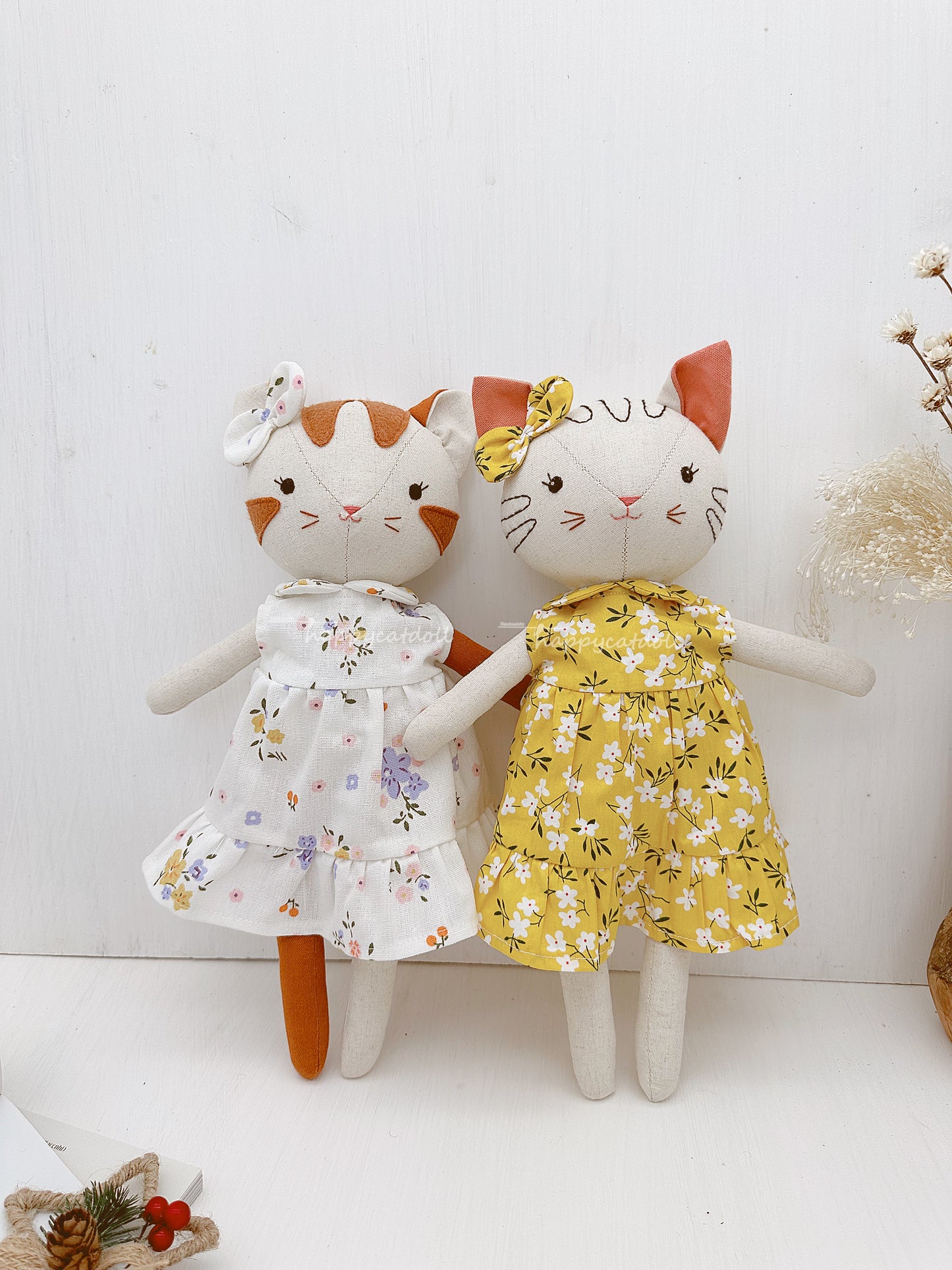 Two cute cat dolls with floral dresses