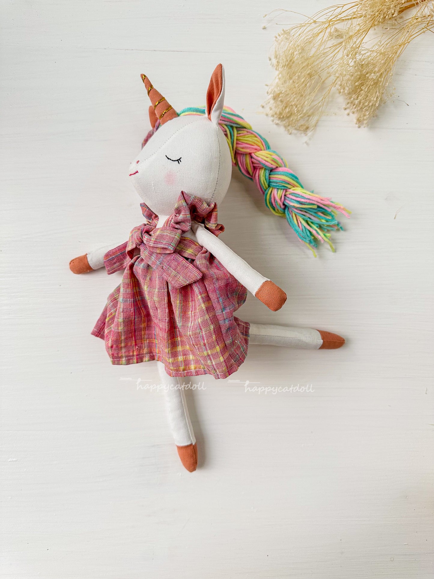 Unicorn with pink checkered dress