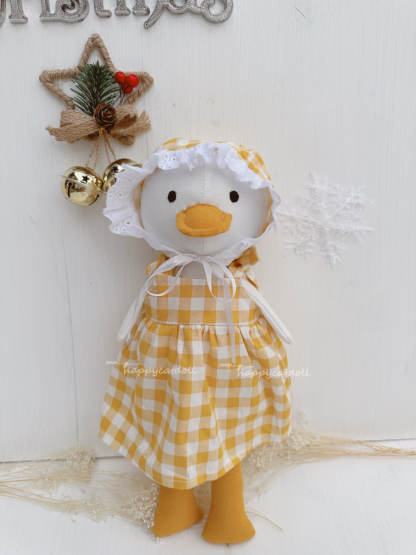 Duck doll with yellow checkered dress