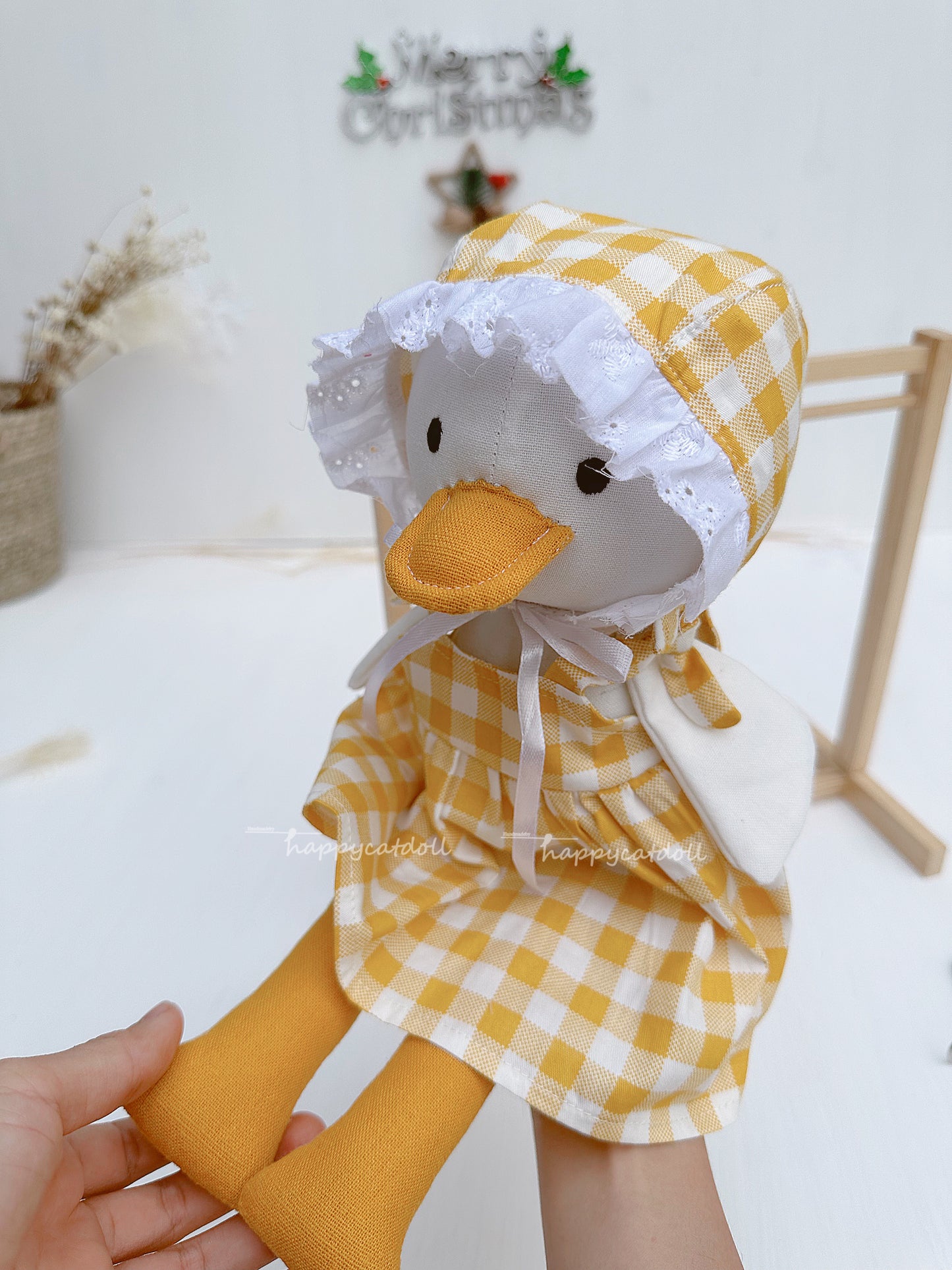 Duck doll with yellow checkered dress