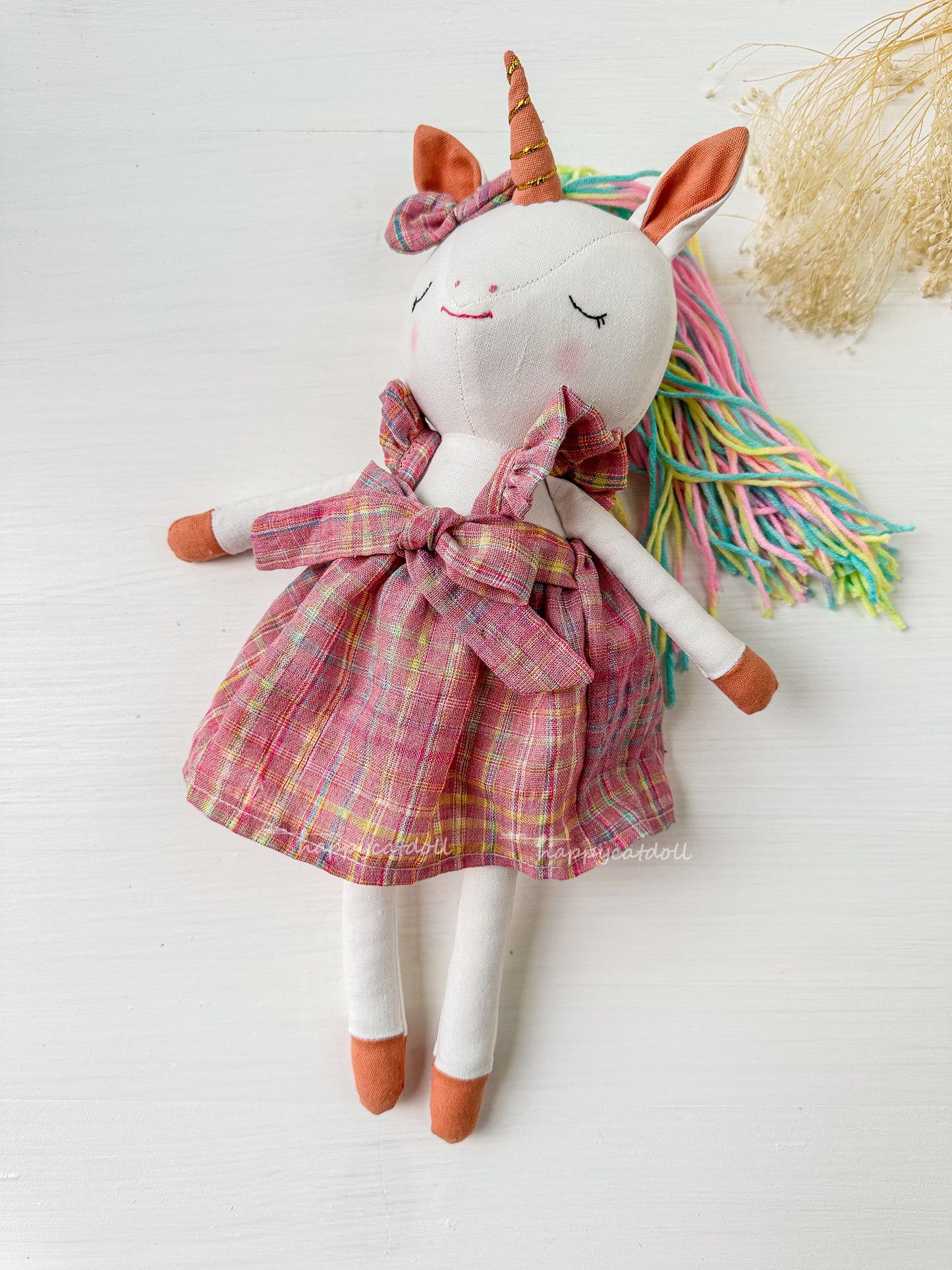 Unicorn with pink checkered dress