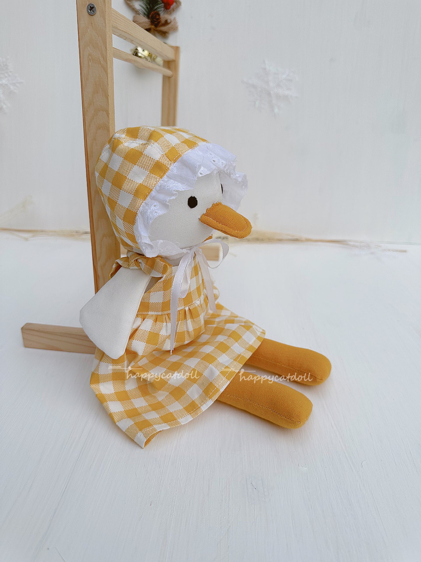 Duck doll with yellow checkered dress