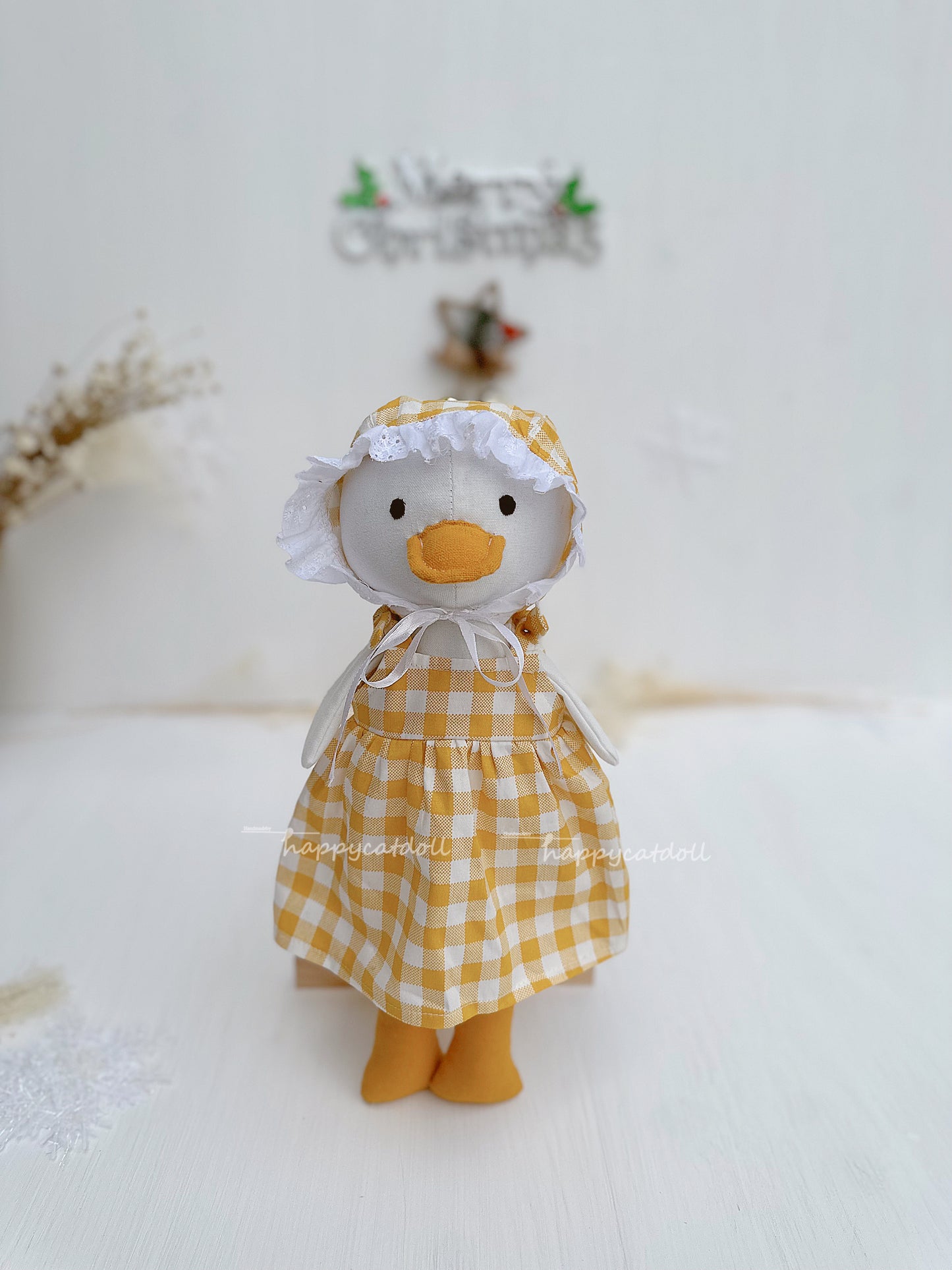 Duck doll with yellow checkered dress