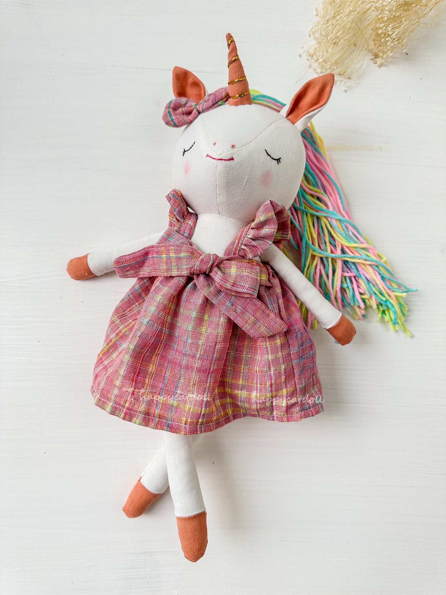 Unicorn with pink checkered dress