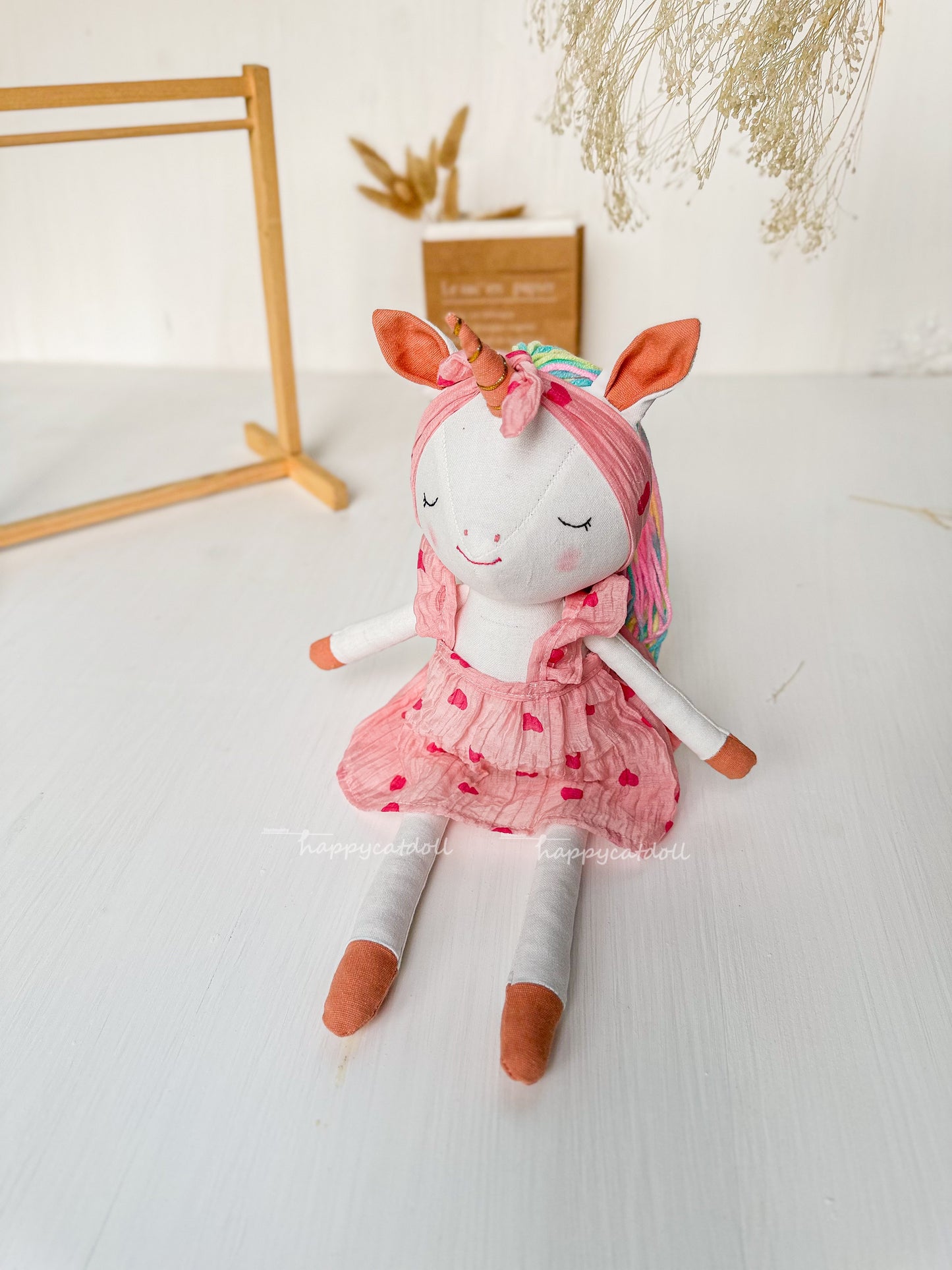 Unicorn doll with pink hearts dress