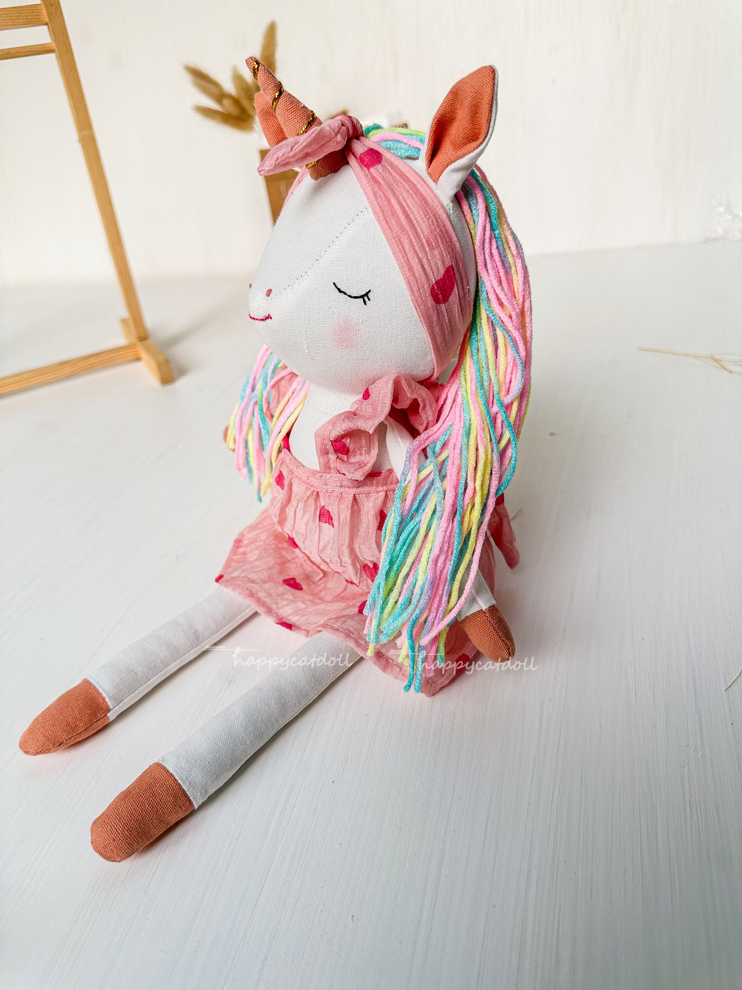 Unicorn doll with pink hearts dress