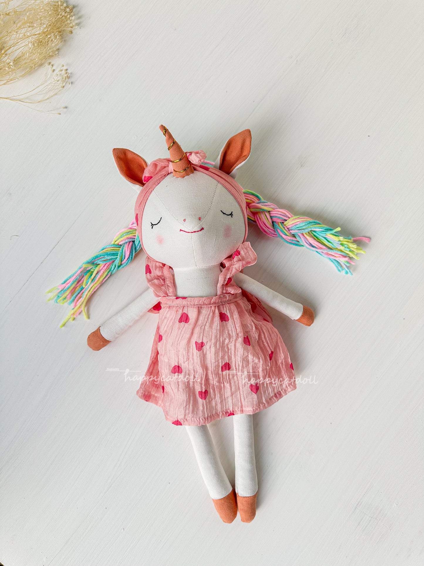 Unicorn doll with pink hearts dress