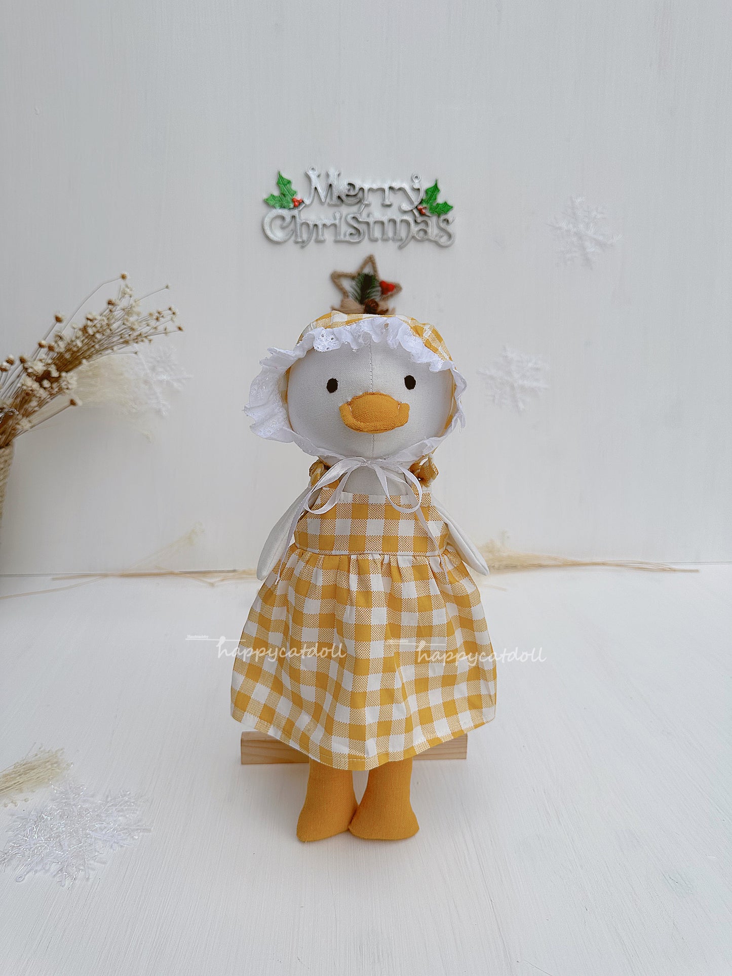 Duck doll with yellow checkered dress