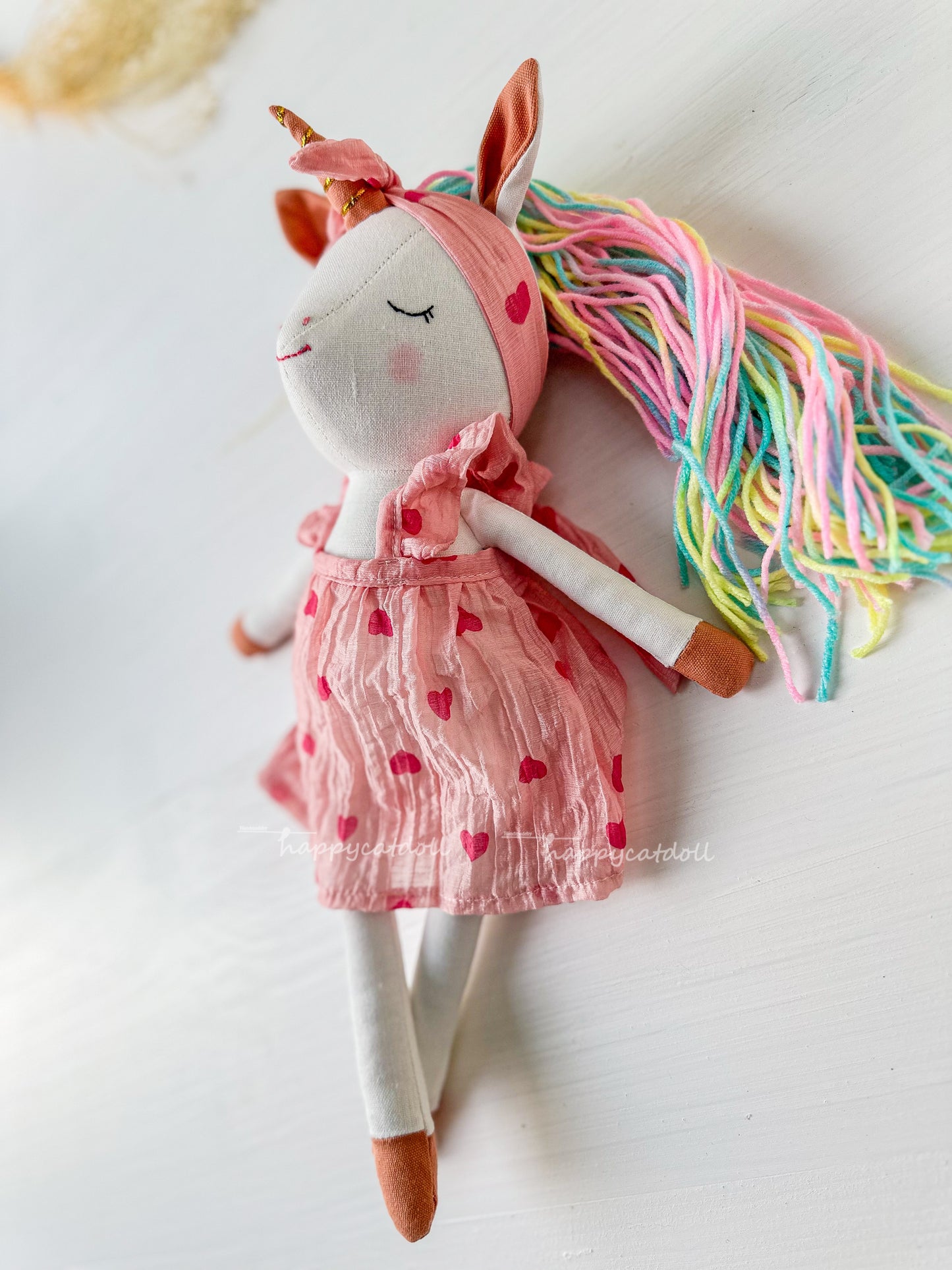 Unicorn doll with pink hearts dress